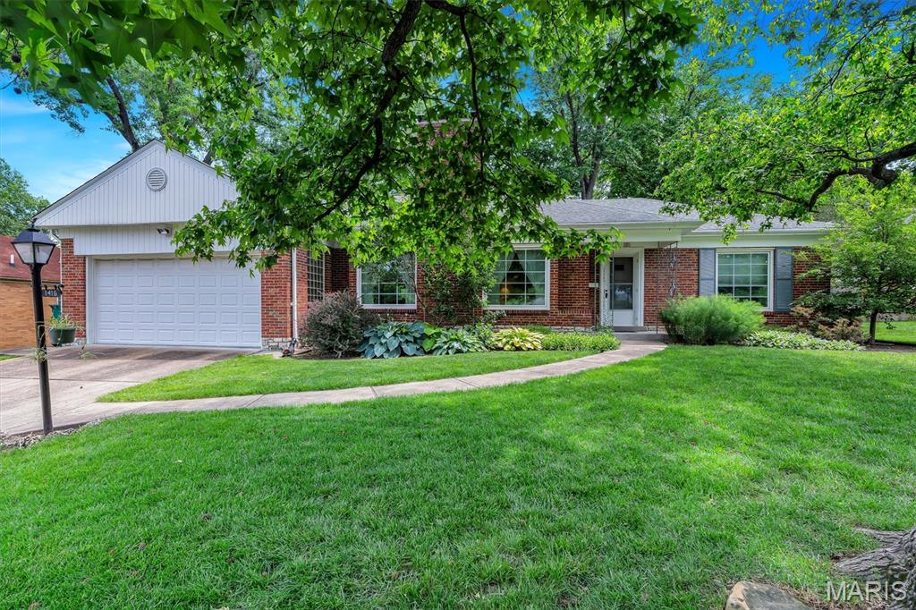 Well Loved Webster Groves Home hitting the market for the first time in 30 years! This mid century gem is classic Cape Cod with undeniable charm. As you enter the original door and step onto the parquet wood entry you can't help but love the large living room with curved ceilings, functional gas fireplace and oversized windows. Steps away is the dedicated dining room which has hosted years of holiday dinners and can easily seat 10. The bright kitchen boasts timeless ceramic walls, large windows, a classic dutch door, and quartz tops. A second living area, the four seasons room is where you will quickly find yourself wanting to relax and unwind as you overlook the flat lot with mature landscaping. In true cape cod fashion, the center hall plan boasts 3 bedrooms including the primary with double slider closets. The 2nd and 3rd both have ample closet space with a shared hall bath. 
The lower level has plenty of room for expansion with a dedicated laundry space, walls, recessed lighting in place. Flooring will need to be added to bring this to full finished space. A fireplace is located in the center and there are multiple spots for storage. In addition, the two car attached garage is super convenient!
Don't miss a chance to own a piece of Webster Groves history in this beautiful neighborhood!