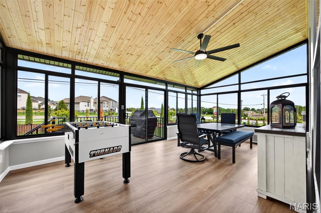Why wait months to build and spend tens of thousands more on upgrades when you can own this exceptional, move-in ready home today? Just reduced to $699,900, this property represents an extraordinary opportunity with approximately $816,000 invested in construction and post-closing improvements, creating value that would be difficult and significantly more expensive to recreate today. Be sure to review the attached upgrade sheet to fully appreciate everything included. MOST FURNITURE CAN BE INCLUDED IN SALE. Designed well beyond typical builder specifications, this beautifully appointed home offers the perfect blend of luxury, comfort, and practicality. The open-concept floor plan is enhanced by soaring 11-foot ceilings in the great room, where a sleek contemporary electric fireplace and mounted television create an impressive focal point. The designer kitchen is equally impressive with quartz countertops, an oversized center island, premium appliances, gas cooktop, stylish backsplash, and abundant workspace for both everyday living and entertaining. One of the home's most remarkable features is the Patriot four-season sunroom, a substantial investment complete with its own dedicated mini-split HVAC system, allowing year-round enjoyment while seamlessly expanding the living space. Just outside, the grilling deck makes indoor-outdoor entertaining effortless. The thoughtful upgrades continue throughout the home, including a private office with French doors, engineered flooring throughout the main living areas, custom pantry and primary closet organization systems, reverse osmosis water system, epoxy-coated garage floor, and a premium appliance package with refrigerator, washer, and dryer all included. Outside, the fully fenced backyard has been professionally finished with premium antimicrobial turf, providing a beautiful, green, virtually maintenance-free outdoor retreat in every season. The unfinished lower level includes a bath rough-in and offers outstanding potential for future living space, allowing the next owner to customize it to their needs. Every finish, upgrade, and improvement reflects an unwavering commitment to quality, making this the perfect home for buyers who appreciate the details that truly set a property apart.Serious upgrades:  Patriot Sunroom ($127,400), Cap-a-tread on stairs to lower level ($1,083) Added ceiling fan to primary bedroom, Front Landscaping ($3798.48), Window coverings ($9,062), Closet Factory organized closet systems in primary closet and fully in garage ($21,470), Dyrwall and paint garage ($4,199), Smart Washer/Dryer ($3,801), Reverse Osmosis System and Soft Water System ($5,301), Synlawn Synthetic and antimicrobial grass in back yard ($31,307), Black aluminum fencing in backyard ($6,524).