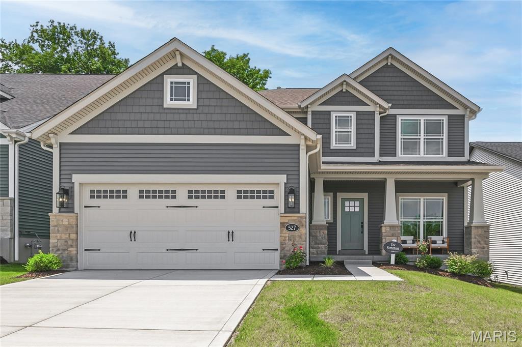Stunning builder display home, ready for immediate move in!  This impressive model home is loaded with todays most desirable features and finishes and is located in the highly desirable Ryehill Manor neighborhood by Fischer and Frichtel.  The curb appeal is fantastic with light craftsman fare, stone, shake accent siding, prairie grills in the windows, carriage style garage door, coach lights, a large front porch, landscape, irrigation and more.  Features include 3 bedrooms, 2.5 baths, 2,468 sq ft, 9 ft ceilings on the main floor, luxury vinyl plank flooring throughout the main level, Flex Room/Office, side staircase design, wrought iron stair spindles, main floor Laundry, 6 inch Craftsman profile baseboards, 42 inch shaker style Frost cabinets with crown, contrast island with seating bar, beverage center/butlers pantry, pendant lights, recessed lights, under cabinet lighting, soft close doors and drawers, dovetail drawer construction, quartz countertops, tile backsplash, walk in pantry, stainless steel appliances, gas cooktop, chimney style hood, microwave, refrigerator, dishwasher, double door entry to the Primary Suite, walk in closet, cultured marble shower with bench seat, free standing soaking tub, raised height dual vanities, luxury vinyl tile, large secondary bedrooms, spacious Loft, HVAC zoned system, 50 gal water heater, Low E windows, rough in bath and a 14 x12 composite deck with steps to a 12x12 patio.  Enjoy outdoor time on your deck and patio with a tree lined back yard.  The garage has added depth and an insulated garage door with opener. This single entrance neighborhood offers easy access to Highways 70 and 370, shopping, restaurants, services and The St. Peters Rec Plex. Ryehill Manor residents will receive a 3 year paid membership to the spectacular St. Peters Rec Plex. Amazing opportunity, check it out!