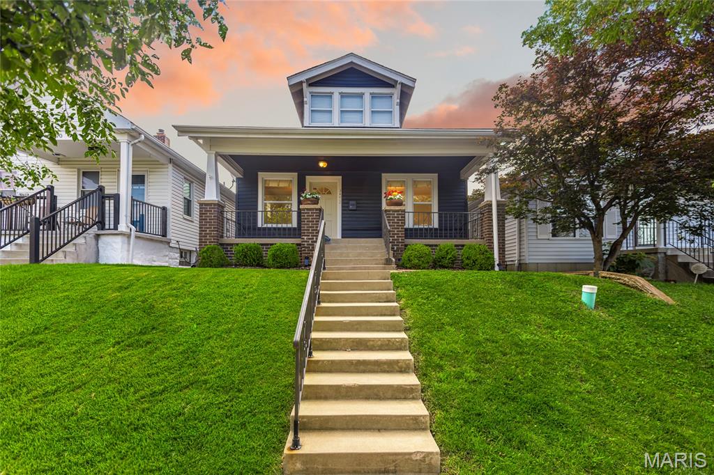 Open Sun, 7/12, 12-2pm. Charming 1.5 story home tucked into one of St. Louis City's most sought-after neighborhoods. This move-in ready home offers 3 Bedrooms, 2 Bathrooms, and over 1,200 square feet of living space! The main floor master suite offers everyday convenience, while original hardwood floors add timeless character throughout. Entertain effortlessly in the generous living room, dining room, and kitchen featuring granite countertops and stainless appliances. Upstairs, two additional bedrooms each with walk-in closets, served by a full bathroom. Relax outside on the front porch or the fully fenced, level backyard with a patio and two-car garage. Located near restaurants, shops, grocery stores, parks, and more!