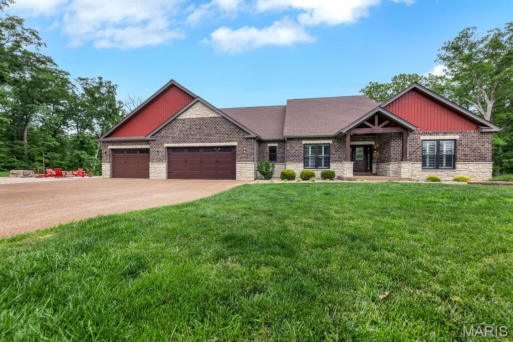 Custom-built luxury meets peaceful resort-style living in this extraordinary home overlooking a stocked lake and surrounded by the beauty of nature. Thoughtfully designed with both everyday comfort and entertaining in mind, this one-of-a-kind property offers exceptional craftsmanship, functional living spaces, and unforgettable indoor-outdoor amenities that truly set it apart.
From the moment you arrive, the setting creates a sense of privacy and tranquility while still being conveniently located just minutes from town. The neighborhood is known for its welcoming atmosphere, pride of ownership, and distinctive homes that avoid the typical cookie-cutter feel found in many communities.
Inside, the open-concept floor plan was intentionally designed to create connection, comfort, and flow throughout the home. Soaring 12-foot ceilings and expansive windows fill the main living area with natural light while showcasing beautiful views of the surrounding property. The spacious family room centers around a stunning fireplace, creating a warm and inviting gathering space year-round.
The chef’s kitchen is equally impressive and was designed to be both beautiful and highly functional. Features include a large gas range, oversized center island, abundant custom cabinetry, extensive countertop space, a large walk-in pantry, and an additional butler’s pantry for added convenience and storage. Whether preparing meals for family or entertaining guests, this kitchen was designed to accommodate it all with ease.
One of the most loved spaces in the home is the incredible screened-in porch featuring two oversized sliding doors that create a seamless indoor-outdoor connection. With refreshing lake breezes and peaceful views of the water and surrounding wildlife, the porch truly functions as a second living room & offers the perfect place to enjoy morning coffee, relax in the evenings, or gather with family and friends throughout the year.
The finished walkout basement with 9-foot ceilings expands the home’s living and entertaining capabilities even further. A dedicated movie theater creates the perfect setting for family movie nights, game days, & hosting guests for special events. Additional finished living areas provide flexibility for recreation, hobbies, fitness, or additional entertaining space.
Step outside and experience a true backyard retreat designed for unforgettable entertaining & everyday enjoyment. The in-ground pool overlooks the stocked lake & serves as the centerpiece of the outdoor living space. The pool is equipped with both a heater & chiller, allowing for an extended swimming season well into spring and fall. An automatic cover provides convenience, peace of mind, improved maintenance, & enhanced energy efficiency.
The outdoor kitchen allows the cook to remain part of the conversation & activities while entertaining, creating a natural gathering space around the pool & patio. Evenings can be spent relaxing around the firepit surrounded by thoughtfully designed hardscaping and natural stone seating areas that complement the beauty of the property. An outdoor Sonos sound system further enhances the experience & creates the perfect atmosphere for entertaining.
Additional highlights include an oversized garage designed to easily accommodate large vehicles while still offering substantial storage, all walk-in closets, extensive built-ins and storage throughout the home, a large aggregate driveway, a convenient dog shower, professional landscaping and hardscaping, and a new roof. Every detail of this home was intentionally planned to maximize both luxury and livability.

More than just a home, this property offers a lifestyle centered around comfort, connection, nature, and entertaining. Whether spending summer days by the pool, enjoying peaceful mornings overlooking the lake, hosting family and friends, or simply appreciating the privacy and beauty of the setting, this home delivers a truly unforgettable living experience.