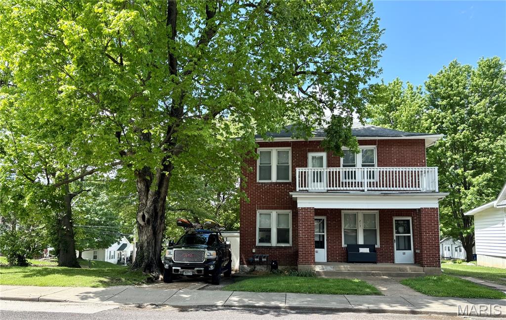 This solid full-brick 2-family home is ready for its next chapter! Endless possibilities here! Each unit features 2 bedrooms, 1 full bath, a spacious living room, and a functional kitchen, with one unit on the main level and the other upstairs for comfortable, private living. The shared basement provides laundry with separate hookups and private access for each unit. The outdoor living is just as appealing, with each unit enjoying its own balcony & a welcoming front porch for both front doors, and a large back yard situated on a corner lot right in the heart of town. Designated parking for each unit right out front plus a small 1-car garage space on one side-great for storage too! Whether you’re looking to grow your investment portfolio, live in one unit and rent the other, or explore additional opportunities, this property offers flexibility and a fantastic location. Per the City of Washington, with approval of a special use permit, the property could potentially be used as a short-term rental-making it especially attractive for traveling healthcare professionals (right near the hospital!) and visitors alike. Two units, one great opportunity-don’t let this one be the one that got away! This is a duplicate listing of 26016620