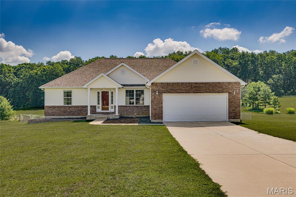 If you’re looking for space to breathe without being miles away from everything, this is the one. Sitting on just over 2.5 acres, this property gives you all the room you need to spread out while being just minutes from town. Inside, you’ll find a freshly updated kitchen that’s bright and ready to go. The main floor features three bedrooms and two full baths, plus the convenience of having your laundry right on the main level.

If you need more room, the basement has you covered. It includes another bedroom, a full bath, a spacious family room, and plenty of extra storage space. When you head outside, you’ve got a back deck perfect for relaxing, and the whole yard is already set up with a chain-link fence. There is also plenty of room for all your vehicles and projects, thanks to the attached 2-car garage, an additional single-car garage in the basement, and a metal shop that’s perfect for all your activities. This place really is the perfect mix of comfort and practicality—come take a look and see if it feels like home!