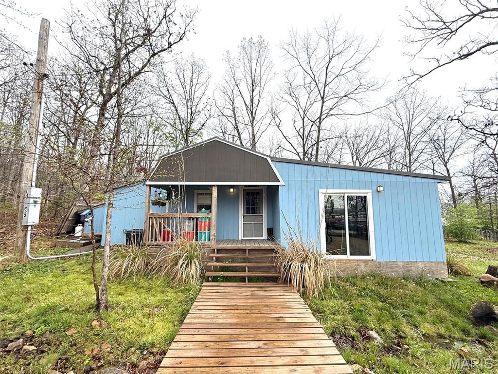Start your lake life now! Come enjoy all that Lake Hanna has to offer! Boating, fishing, swimming, and ATV trails galore! This cabin is roomy and can comfortably accommodate large families. 4 separate bedrooms and a loft, ensuring everyone has a space. Primary bedroom has a large add on that could be finished into more living space, or a huge primary bathroom! Bring your visions! Enjoy the large living room to relax in after spending all day out on the lake. Cabin is sold as is, but you can come enjoy it right away, or finish a few projects for a seamless look. Come take a look and snag this beauty before its summer!