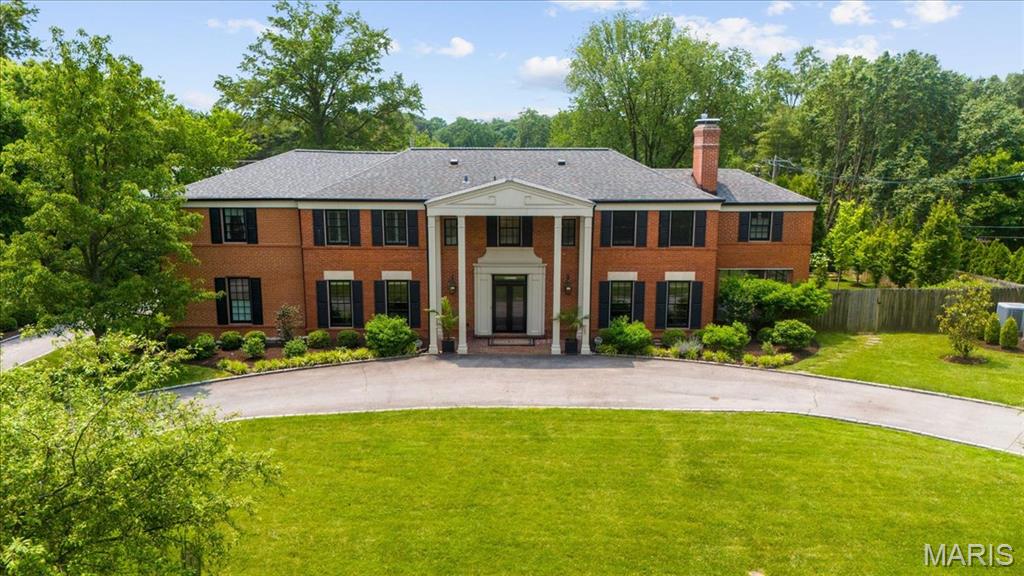 Perfection awaits in this one-of-a-kind residence, ideally situated on an expansive & meticulously landscaped 0.7-acre fully fenced lot. Reimagined from the studs up, this home has been entirely rebuilt w/ the finest materials, designer finishes, & a thoughtful floor plan that blends timeless elegance w/ modern comfort.  Offering 5 beds & 6 full baths, the home features 4 beds & a laundry room on the upper level, w/ a guest suite & full bath conveniently located on the main floor. An additional full bath can be found in the finished LL.  The heart of the home is the gourmet kitchen, complete w/ a massive center island & a wall of windows that frame views of the lush backyard. The kitchen flows seamlessly into an oversized family room, ideal for everyday living & entertaining. A formal dining room w/ a bay window & a gracious living room add to the home’s classic appeal, while a screened-in porch offers year-round enjoyment. A dedicated office provides the perfect space for work or study.  Additional features include an oversized 3-car garage equipped w/ 3 EV charging stations & a setup ready for a golf simulator. A custom-designed mudroom offers walk-in storage, a chilled water bottle filling station, & a secondary laundry area. The finished LL adds valuable living space & includes a full bath. Combining the feel of new construction w/ exceptional craftsmanship & sophistication, this extraordinary home is a rare offering in one of the area’s most desirable neighborhoods.