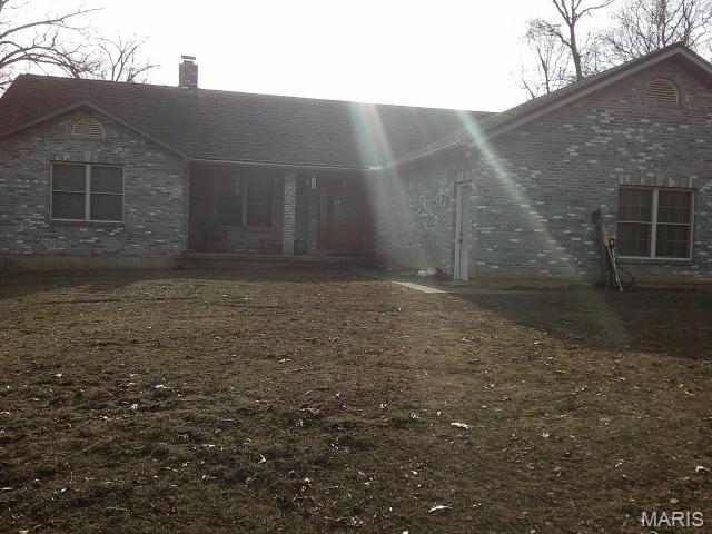 VIEWS with PRIVACY! 1968 sq. ft. all brick home on 34.6 Acres with attached 2 car garage. Master bedroom has a very large walk-in closet. Main floor laundry room with 1/2 bath. Large kitchen with breakfast bar & separate dining. Bedrooms 2 & 3 have a Jack n Jill full bath between. All brick floor to ceiling fireplace in living room. Large deck that spans entire length of home. Several spots to access deck including French doors in kitchen & master bedroom. The view from deck overlooks the surrounding valley. Great spot for morning coffee! Hardy outdoor wood furnace that can assist in heating (including supplementing hot water heater). 2 Parcels make up the 34.6 Acres (see arial). Children attend De Soto Schools. Even though one Parcel pays taxes to Washington County School District. If you're looking for a home in the country with lots of privacy, then this is worth viewing. Call with any questions or to set up your viewing. NOTE: Home has Erie Metal Roofing Shingles, Leaf Filter Gutter Guards were installed over the summer.