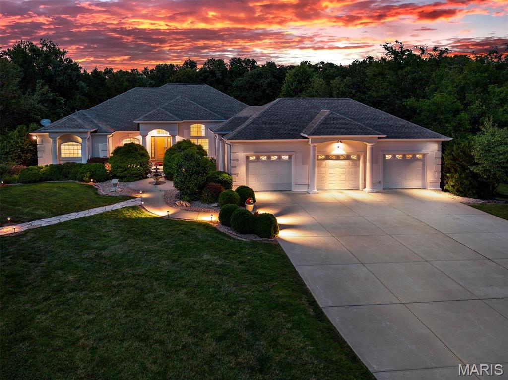 This beautiful home has so much to offer. Location location, 3.2 beautiful acres, an inground pool and a huge shop! The main floor features an over sized primary bedroom with a fireplace and sitting area, a large attached bathroom and access to the pool patio. The large kitchen looks into the livingroom and has access out to the amazing pool area. The second bedroom on this floor is a great size and has a very large walk in closet. The main floor laundry, seperate dinning area and large office space help round out the main floor but lets not forget the amazing atrium ranch enterence with the view of the pool and a seperate half bath with access straight from the pool patio. The basement features a large entertaining area, pool table, large theater room with upgrades, a 3rd bedroom, another full bath and tons of storage area. There are 2 seperate walk outs onto the beautiful wooded property that surrounds. Did I mention the home has newer HVAC and a whole home audio system. The exterior doesn't only offer a park like setting but the stamped concrete pool area along with the large covered porch where the sound system and TVs stay are a dream. The pool liner was new in 2025 along with the pump, filter and heater! It doesn't stop there, there is also a large outbuilding, fully concreted and insulated. This building has a covered porch, a kitchenette, half bathroom, 3 bays, heated and cooled and features a Walk in Cooler for all you hunters!!! Give me a call today for more details.