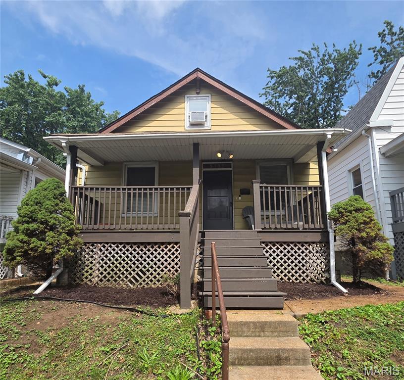 Welcome to this adorable bungalow in Bevo Mills area. Look at all the ideas for this bungalow!  Main floor has 2 bedroom/ 1 bath, living room and updated kitchen with breakfast/dining area attached.  Nice view from dining area out to the fenced in backyard with larger patio, double parking pad for off street parking and your own fruit trees, room to add more parking or garage.  Both main floor bedrooms have larger closets.  Upstairs is an additional finished bonus living space for another bedroom or children's play, endless potential.  Basement offers additional family room/rec room space and storage spaces. There is walkout to backyard. Carpeted 2nd floor 2019, microwave/fridge/kitchen faucet(2022), back patio (2022), bath vanity (2025), dishwasher(2022) Covered front porch perfect to sit and relax for morning coffee or rainy day. Virtually staged pics...look at all this potential with some white paint...Close to park, shopping and restaurants...here it is just waiting for your personal touches!