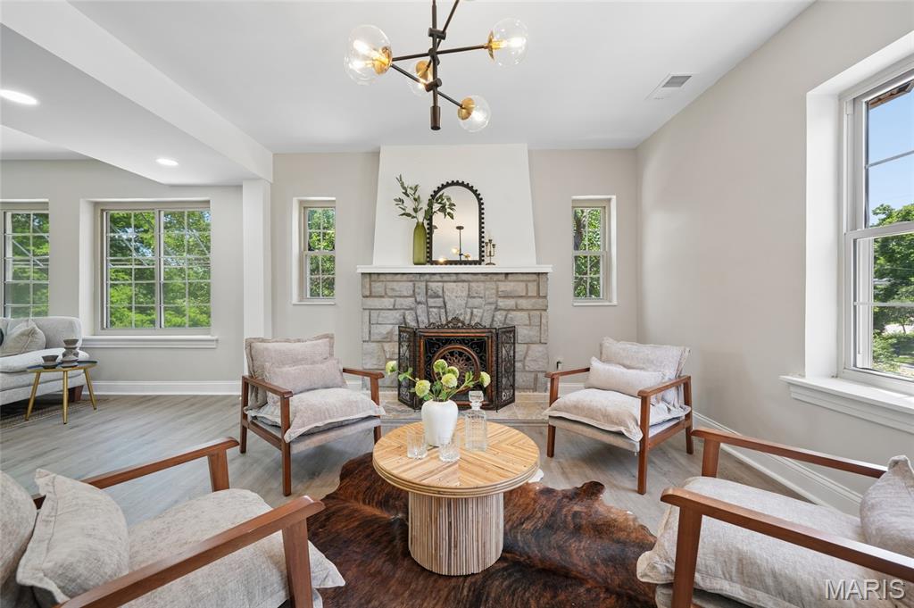 Completely renovated from top to bottom, this exceptional 4-bedroom, 4 full-bath home beautifully blends timeless character with today's modern luxury. From the moment you step inside, you're welcomed by an expansive, light-filled living room with a cozy fireplace that flows effortlessly into the spacious dining area and beautifully updated kitchen—creating the perfect space for everyday living and entertaining. The main level also features a dedicated home office, a luxurious primary suite with a spa-inspired ensuite bath, an additional bedroom, and a second full bath.
Upstairs, you'll find two generously sized bedrooms, a full bath, and a versatile bonus room that can easily serve as a home office, playroom, nursery, dressing room, or additional storage. The finished walk-out lower level offers incredible flexibility with two oversized recreation and family rooms, a fourth full bath, and abundant storage space, making it ideal for entertaining, movie nights, a home gym, or multi-generational living.
Thoughtfully renovated throughout, the home showcases beautifully updated bathrooms, quality flooring, modern lighting, fresh designer paint, and stylish finishes at every turn. An oversized attached two-car garage and generous utility/storage area provide exceptional everyday functionality.
Step outside to your own private retreat, where the expansive, park-like backyard offers endless opportunities to relax, entertain, or play. Surrounded by mature trees and lush green space, the charming stone outdoor fireplace creates the perfect setting for cozy evenings with family and friends. Combining generous living spaces, a flexible floor plan, and extensive renovations, this truly move-in-ready home offers an exceptional blend of luxury, comfort, and timeless appeal.