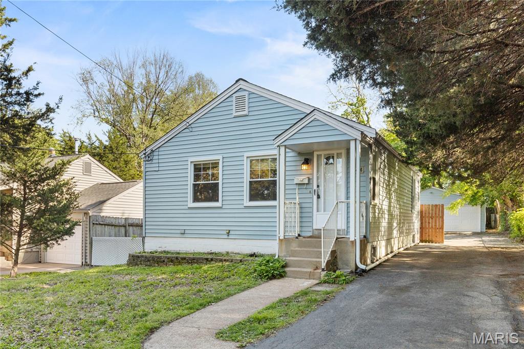 Completely updated and move-in ready - this home has a current passed occupancy, this charming agent-owned home offers the perfect blend of character and modern updates! The bright kitchen features white shaker cabinetry, stainless steel appliances, updated countertops, tile flooring, and stylish backsplash details. Refinished hardwood floors run throughout the main level, while neutral paint tones and abundant natural light create a warm, inviting feel.
The finished lower level adds incredible additional living space with a large rec area, bonus sleeping/office space, full bath with tiled walk-in shower, and plenty of storage. Outside, enjoy a long driveway leading to an oversized detached 2-car garage and fenced backyard with mature trees for added privacy. Conveniently located near shopping, dining, parks, and major highways, this home is ideal for owner-occupants or investors alike.