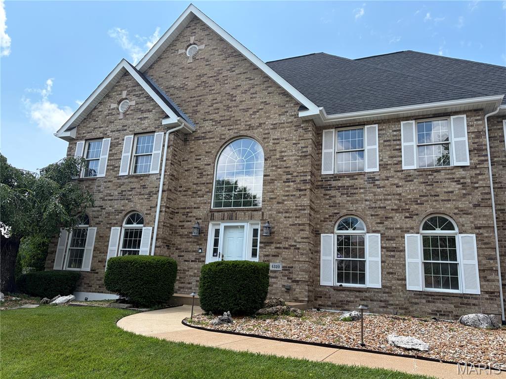 Welcome to this beautifully landscaped, brick-front home in the highly sought-after Christopher Winds neighborhood. Spacious, highly appointed, and filled with thoughtful details, this residence offers exceptional living space across three finished levels.
The impressive two-story entry foyer sets a welcoming tone. To the front, the living room (currently used as a home office) flows into a formal dining room featuring rich Brazilian hardwood flooring, chair rail, and elegant crown molding that continues throughout the entire first floor. All three levels have been freshly painted for a bright, move-in ready feel.
The large family room is a standout, boasting five window bays that flood the space with natural light, a cozy gas fireplace, and a convenient walk-behind wet bar—perfect for entertaining. The adjacent kitchen offers maple cabinetry and durable granite countertops. A hearth/sitting room with French doors sits just off the kitchen, opening to a bright sunroom that features its own exterior entrance. Dual staircases (front and rear) provide excellent flow throughout the home.
Upstairs, the luxurious master suite is accessed through double doors and includes a spacious bedroom with crown molding and a ceiling fan. The private master bath features a double vanity, whirlpool tub, separate shower, and a generous walk-in closet. Three additional bedrooms (all with crown molding and ceiling fans) complete the upper level: one with its own private full bath and the other two sharing a Jack & Jill full bath. Many of the bathrooms have been updated with newer vanities.
The fully finished lower level offers fantastic versatility with a bar area, second family room with fireplace, open game/recreation space, a second kitchen, a fifth bedroom, and a convenient walk-out to the backyard and patio.
Outside, enjoy the private backyard with its newer deck and updated patios—ideal for relaxing or entertaining. The oversized three-car side-entry garage provides ample storage and parking.
This wonderful home combines classic elegance with modern comforts in one of the area’s most desirable neighborhoods. Ready for its next chapter!