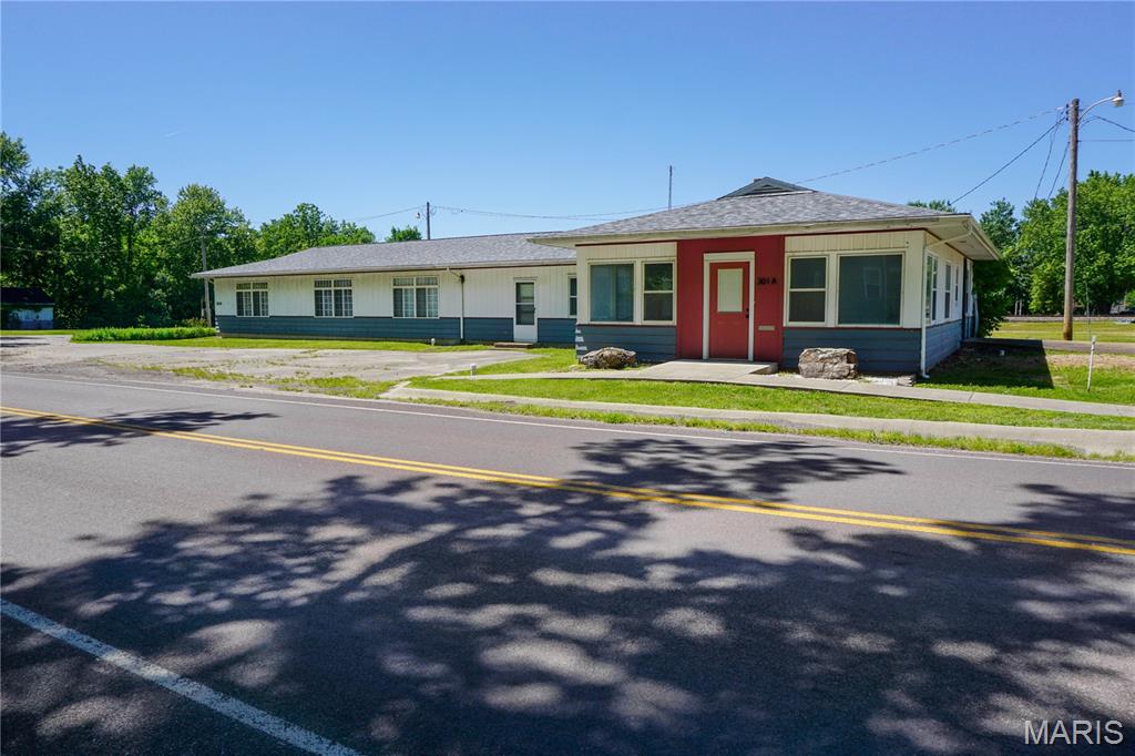 Commercial property offering a highly functional mix of office, warehouse, and storage space on 2.19 m/l acres. The 3,840 m/l sq. ft. main building includes a reception area, 10 private offices, conference room, full kitchen/break area, 3 restrooms, and multiple storage areas providing flexibility for a variety of business operations.

An attached warehouse/garage with overhead door allows for convenient loading, equipment storage, or service use. A separate 42x50 detached storage building adds additional capacity for materials, inventory, or equipment.

The building is served by 3 HVAC systems with electric forced air heat and central air. Phase I and Phase II environmental reports have already been completed by the owner, providing added confidence for future use or redevelopment planning.

This property is well-suited for contractors, trades, service companies, light industrial users, or businesses needing a combination of office space and functional storage/warehouse capabilities in one location. Plenty of on-site space supports parking, operations, and future adaptability.