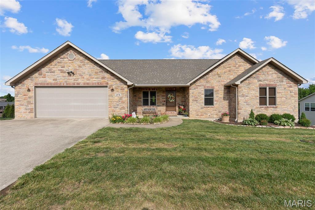 **New price reflects listing home without the additional acreage.**Welcome to this custom built home on the largest lot in Cedar Meadows Subdivision. This four bedroom, three bathroom home offers a beautiful stone fireplace in the basement, gorgeous hard wood floors, a well maintained deck off of the kitchen, as well as a patio off of the basement. The large backyard is partially fenced in case you have a pet or would like to install a pool. There are spacious living areas plus a private mother-in-law suite in the basement—ideal for guests, extended family, or multi-generational living. Other special touches include a large room off of the garage and main floor laundry room that is an ideal office space, and there is a John Deere style room off the basement ideal for extra storage of your outdoor items. There is plenty of storage space in the unfinished portion of the basement.