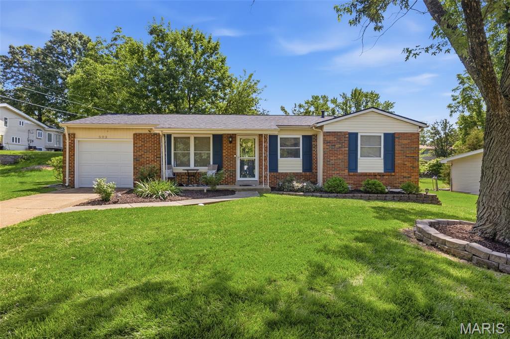 Don't miss this stunning home nestled in the heart of West County. Inside the bright, open floor plan and hardwood floors greet you. The kitchen features updated cabinetry, and flows into the dining area. French doors off the dining area open to a beautifully landscaped, fully fenced backyard. Primary bedroom with updated ensuite and walk in glass shower. 2 additional bedrooms and an updated full bath complete the space. Downstairs, the partially finished basement expands your living space considerably, offering a large family room and a bar area perfect for game nights and gatherings. Attached 1 car garage. New roof (2024) HVAC (2022) Hot Water Heater(2023). Located close to shops and restaurants. Schedule your private showing today!