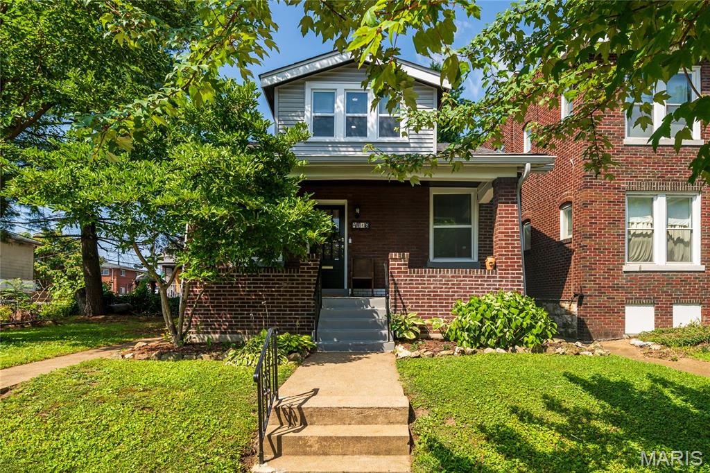 Open House Sunday, 1-3pm. You've watched the market and dreamed of owning an adorable bungalow, but thought it might be out of reach. Your wait is over—the bungalow you've been searching for has finally arrived!

Start your mornings on the charming covered front porch, coffee in hand, enjoying the beauty of the neighborhood. Step inside and immediately notice the gorgeous stained-glass windows, gleaming hardwood floors, and the beautifully updated kitchen featuring stainless steel appliances, shaker-style cabinetry, subway tile backsplash, and a convenient pass-through window to the dining room—perfect for entertaining family and friends.

The main level offers two generously sized bedrooms and a timeless black-and-white full bath. The second bedroom also makes an ideal home office, reading room, or flex space. Upstairs, you'll find a spacious private primary suite complete with its own full bathroom and plenty of room for a sitting area, workout space, or morning yoga retreat.

Step outside from the kitchen and prepare to be impressed by the expansive fenced backyard. Whether you envision gardening, hosting summer barbecues, gathering around a fire pit, or simply relaxing outdoors, this space delivers. A detached one-car garage with alley access provides added convenience and storage.

This charming bungalow blends classic character with thoughtful updates, creating the perfect place to call home.