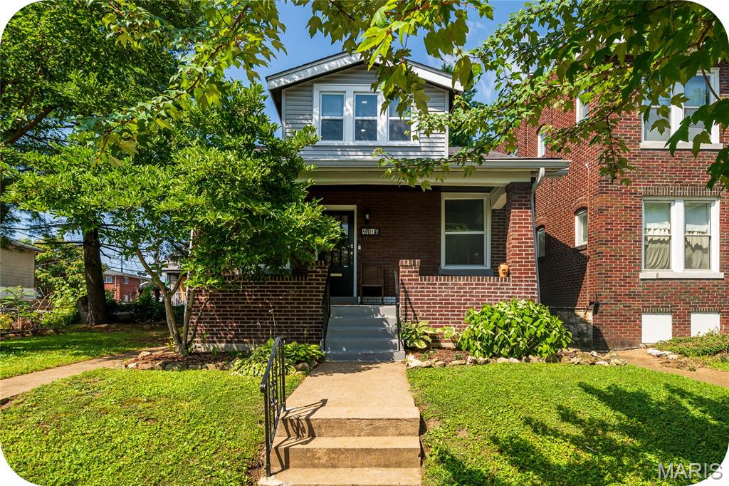 Open House Sunday, 1-3pm. You've watched the market and dreamed of owning an adorable bungalow, but thought it might be out of reach. Your wait is over—the bungalow you've been searching for has finally arrived!

Start your mornings on the charming covered front porch, coffee in hand, enjoying the beauty of the neighborhood. Step inside and immediately notice the gorgeous stained-glass windows, gleaming hardwood floors, and the beautifully updated kitchen featuring stainless steel appliances, shaker-style cabinetry, subway tile backsplash, and a convenient pass-through window to the dining room—perfect for entertaining family and friends.

The main level offers two generously sized bedrooms and a timeless black-and-white full bath. The second bedroom also makes an ideal home office, reading room, or flex space. Upstairs, you'll find a spacious private primary suite complete with its own full bathroom and plenty of room for a sitting area, workout space, or morning yoga retreat.

Step outside from the kitchen and prepare to be impressed by the expansive fenced backyard. Whether you envision gardening, hosting summer barbecues, gathering around a fire pit, or simply relaxing outdoors, this space delivers. A detached one-car garage with alley access provides added convenience and storage.

This charming bungalow blends classic character with thoughtful updates, creating the perfect place to call home.