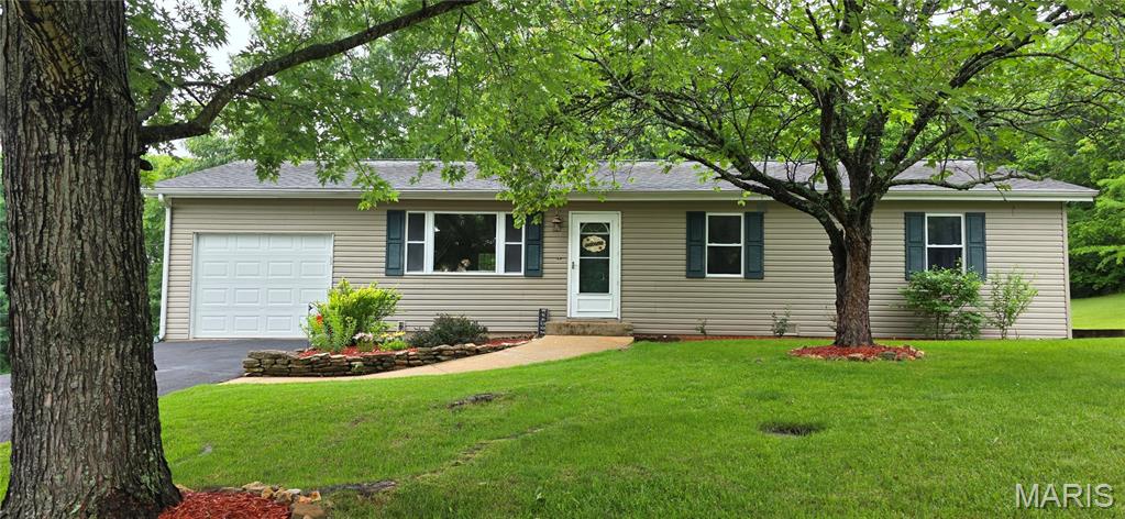 Welcome to 1 Kathryn Drive in St. James, Missouri! This beautifully maintained 4-bedroom, 2-bath home offers over 1,800 square feet of comfortable living space with a layout designed for everyday living and entertaining alike. From the moment you arrive, you’ll notice the pride of ownership throughout the property.

Inside, you’ll find spacious living areas, generously sized bedrooms, and a large primary suite that offers the perfect private retreat after a long day. The home features a warm and inviting atmosphere with plenty of natural light and functional space for families, guests, or even a home office setup.

The large 1-car garage provides additional storage and convenience, while the private backyard creates a peaceful outdoor setting ideal for relaxing, entertaining, or enjoying quiet evenings at home. Whether you’re grilling with friends or simply enjoying the outdoors, this backyard offers privacy and comfort.

Located in a desirable area of St. James, this move-in ready home combines space, value, and excellent condition all in one package. Schedule your showing today!