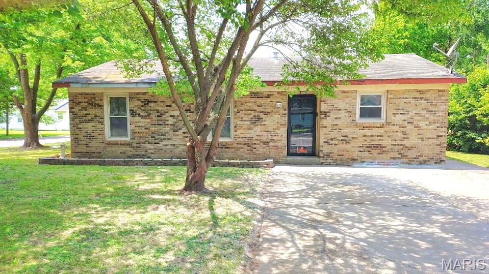 This 3-bedroom, 1-bath home sits on a corner lot, offering a shaded front yard and plenty of curb appeal. A spacious sunroom faces the large, fenced backyard - perfect for a summer BBQ and entertaining. Need storage space? This home features entryway and hall closets, an exterior storage space just outside the sunroom, and a small storage shed. Affordably priced to allow for some interior TLC, it is perfect for DIY to give the space your own touches and make it feel like home. Centrally located and close to schools.