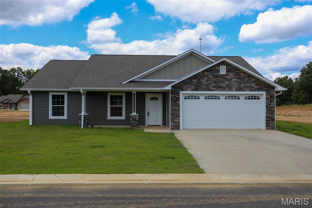 Welcome to 217 Gucci Lane, a brand-new construction home located in a Western Butler County development just south of the Township Line Road roundabout. Designed for ultimate low-maintenance living, this all-electric, single-level ranch home features a low maintenance vinyl exterior accented with stone work, an attached two-car garage, and a completely level yard.

Inside, the open-concept floor plan is highlighted by vaulted ceilings and durable, contemporary solid surface flooring that runs throughout the entire home. The open layout connects the main living space to a modern kitchen that comes fully equipped with a complete package of brand-new stainless steel appliances. This home will qualify for most all gov't loans. 

The highly desirable split-bedroom design ensures maximum privacy for the primary suite, which serves as a retreat with its spacious walk-in closet and an ensuite bath featuring a custom tiled shower and dual-sink vanity. With everything completely brand new and situated just minutes from Poplar Bluff's schools, shopping, and medical facilities, this home is entirely turn-key and ready for its very first owner.