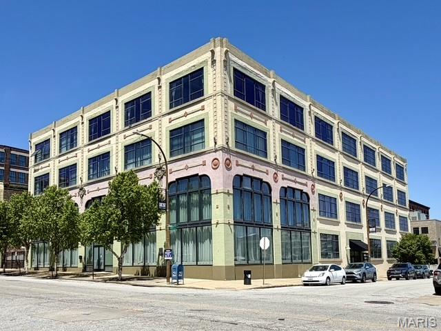 Experience elevated downtown living in the iconic Packard Lofts — the Art Deco style building originally home to the historic Packard automobile dealership. Perfectly positioned at the corner of 22nd & Locust, just blocks from Union Station and within a block of the St. Louis City Soccer stadium, this extraordinary loft places you in the heart of downtown development and entertainment.

This stunning 4-bedroom, 4-bath penthouse offers a truly one-of-a-kind urban living experience blending timeless architectural character with modern convenience. Massive warehouse-style windows fill the space with natural light while showcasing breathtaking west and south-facing city views, including captivating sights and sounds of the soccer stadium. Designed for both entertaining and everyday comfort, the residence features two expansive living areas, two spacious kitchens, and private bedrooms with doors for added flexibility and privacy.

Original industrial details pair beautifully with the 2006 renovated contemporary finishes, creating a sophisticated yet versatile space that complements any design style. Enjoy vibrant city living just moments from popular downtown destinations including Schlafly Tap Room, Lombardo's Trattoria, Maggie O'Brien's, Ozzy's Market and much more!  Two in-building garage parking spaces are included. Exceptional location offering downtown convenience, corner/end-unit privacy, and commanding skyline views from this remarkable penthouse suite.