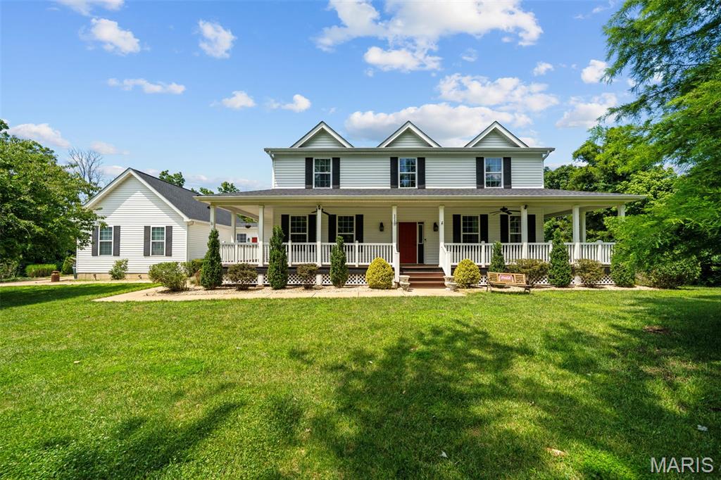 Continue to show for back up interest....One acre retreat nestled in the heart of St Louis County this warm and inviting wrap around front porch [stained, sealed plus new steps and stringers 2026] pulls you in the minute you arrive!  If the built in saltwater pool doesn't grab you..the 10 ft ceilings on the main level , wood flooring, main floor primary suite offering custom closets [2023], the flow of this interactive versatile floor plan certainly will!!  SO many needs are met within this floor plan...  The 2nd floor loft offers great natural light in addition to an ensuite bedroom  and 2 additional bedrooms connected by a Jack and Jill bath.  The walk out lower level [new slider door 2026!] with a deep pour offers a kitchen area [2025]  and THIRD family room space plus a bonus room that could be a small bedroom or office!  Plenty of storage yet in the LL or room to expand the finished area.  The oversized 3 car garage with high doors lead you into a family drop spot before you enter the house and the separate entrance into this area adds to the versatility!  The screened in porch [sliding door new in 2025] and newer large expanded deck [2025] overlooking the pool offers great gathering spaces or to enjoy simple moments!  Roof, siding, gutters garage doors ,  and some windows replaced in 2025... Zoned HVAC, inground sprinkler system and a fenced side yard area [2025] separate from the pool decking area is great for pets!  LG washer and dryer [2023] LG kitchen appliances [2024]  to include kitchen fridge stay !  Some light fixtures and kitchen/bathroom faucets updated.  This property was built in 2009 and offers details such as higher floor moldings, deep windowsills, window casing and there is no HOA.  Pool table,  in LL and Ring camera stays with the house.  St Louis County re-occupancy clear inspection and clear VP Fire reports available and transferable Choice home protection plan that includes pool coverage to new owner  through 7-27-2030!!