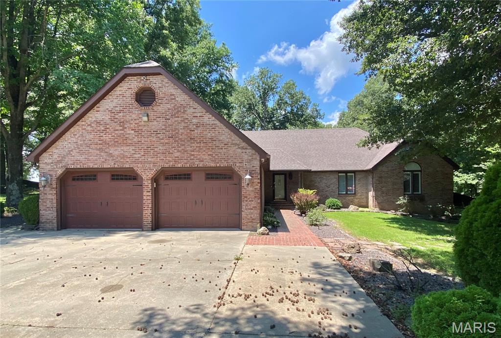 A Must See ! This beautiful 4 /5 Bedroom home you can enjoy the scenic view from your deck on #12 fairway of Hidden Trails Golf Course. This home sits on a quiet cul- de- sac sitting on 1.3 acres. As soon as you walk in, your greeted with new flooring on main floor featuring a charcoal gray gas fireplace, Spacious open concept living and dining area. Contemporary kitchen with granite countertops , pantry and stainless steel appliances that stay with the new homeowner. Two bedrooms and master suite on main floor ,stunning remodeled master bath and walk-in closet. Upstairs you will find a media room/bedroom /playroom , endless possibilities. Downstairs boasts a large family/recreation room with bar /kitchen . 4th bedroom and full bath , large storage area ,safe room and 3rd garage with overhead door.