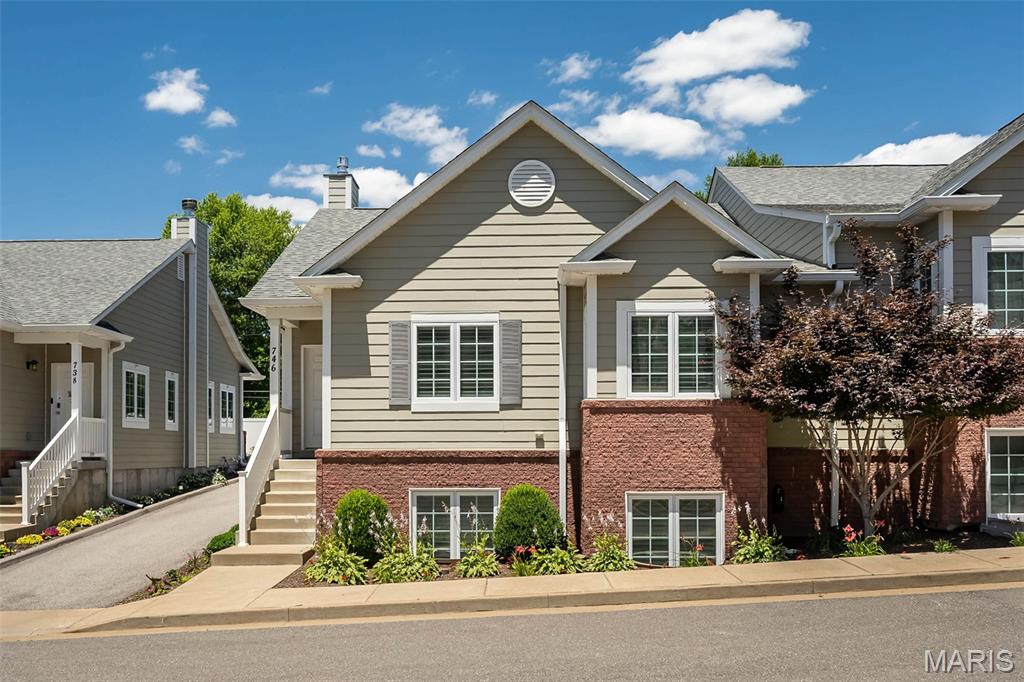Enjoy the ease of villa living in this beautifully maintained 2-bedroom, 2-bath villa with 1,423 square feet of light-filled living space, offering the perfect blend of comfort, style, and low-maintenance convenience. Soaring vaulted ceilings and a wide open floor plan create a bright, welcoming atmosphere, while rich cabinetry, stainless steel appliances, a breakfast bar, and an oversized custom pantry make the kitchen as functional as it is inviting! The spacious primary suite serves as a private retreat featuring a sitting area, walk-in closet with custom organization system, and an ensuite bath with double vanity, walk-in shower with bench seating, and relaxing jetted tub. A generously sized secondary bedroom with walk-in closet and an additional full bath provide comfortable accommodations for guests, work from home, or everyday living. The unfinished lookout lower level offers incredible potential with large windows, a full bath rough-in, and ample space to customize additional living areas, guest quarters, hobby space, or future bedrooms. An attached 2-car garage with minimal entry steps, private patio, and attractive landscaping add to the appeal. Ideally situated near shopping, dining, entertainment, major highways, and backing to Grant's Trail, this spacious villa offers the carefree lifestyle you deserve!