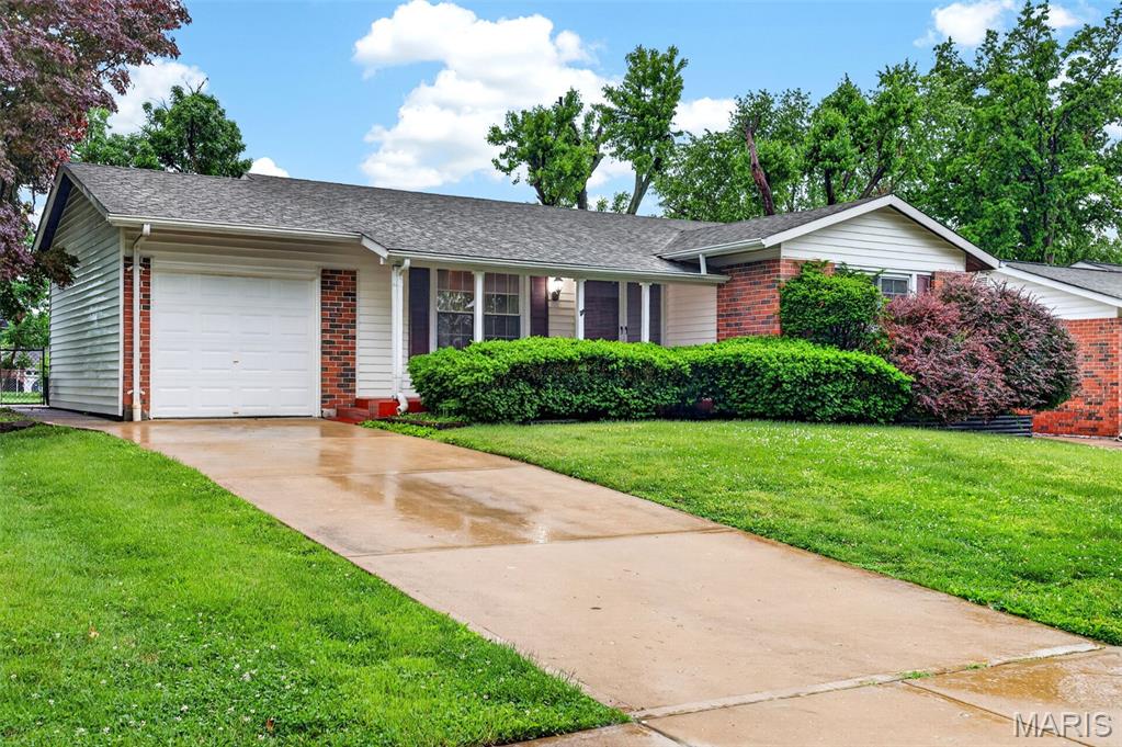 Some homes check the boxes — this one gives you the backyard, finished basement, and neighborhood feel buyers actually want.

Welcome to 2150 Canterbury in the sought-after Wedgwood Subdivision of Florissant! Known for its mature trees, pride of ownership, and strong community feel, Wedgwood offers quiet residential streets with convenient access to parks, shopping, schools, and major commuter routes.

This well-maintained 3-bedroom, 2-bath ranch offers a functional and inviting layout with thoughtful updates throughout. The spacious living room flows seamlessly into the eat-in kitchen, creating an open and comfortable space perfect for both everyday living and entertaining. Hardwood floors add warmth and character, while the primary bedroom features its own private attached bathroom for added convenience.

The finished lower level expands your living space even further with brand new carpet—ideal for a family room, rec area, home office, workout space, or guest retreat.

Step outside to enjoy the flat, fully fenced backyard perfect for pets, play, backyard gatherings, or simply relaxing after a long day. With its blend of indoor comfort, outdoor space, and established neighborhood charm, this move-in ready home is a fantastic opportunity in one of Florissant’s most established communities.