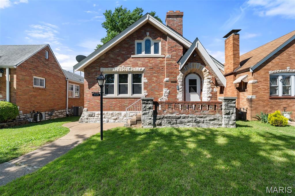 Just 2 1/2 blocks from Carondelet Park sits this wonderful brick home that will shine with your finishing touches. The original wood front door with its stained glass window remains, as does more stained glass throughout the house. It's a cute 2-bedroom with a lower level that has been used as a TV room, bar, and memorabilia area, so it seems bigger. It even has a sump pump! There's also a door with a staircase that leads to an attic space that can be converted into an office or another bedroom. The tub has been refinished to a gleaming white, and there's an updated sink in the bathroom. The kitchen has newer cabinets and quartz countertops, and there's an enclosed back porch. Walk to the park to play pickleball or go biking on the nearby trail! Such a great place to be.