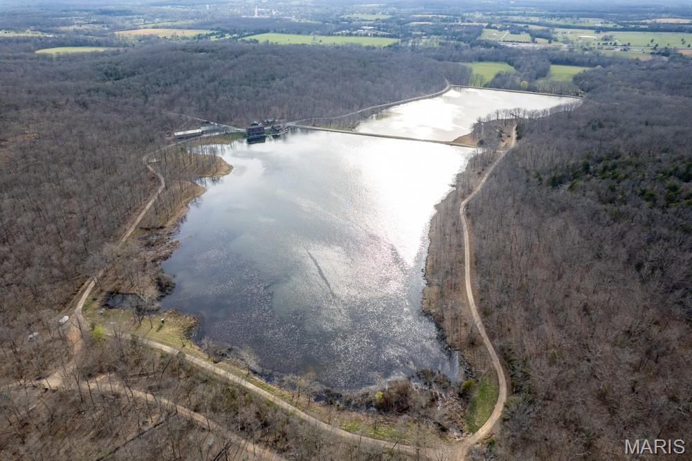 Midwest Land Group proudly presents the Twin Lakes Whitetails Hunting Preserve, a remarkable 847-acre property designed as a turnkey trophy hunting destination in St. Francois County, MO. This unique preserve is renowned for its exceptional whitetail genetics and outstanding amenities, making it an ideal spot for outdoorsman and those seeking an extraordinary retreat.

The property showcases the scenic beauty of the eastern Ozarks, with two stunning lakes welcoming visitors as they wind through the valley toward the main lodge. Multiple high points provide expansive views in every direction.  Approximately 35 acres of open ground, established roads and trails, and a robust perimeter fence contribute to the functionality and security of this remarkable estate.  Located just minutes outside of Bismarck, MO, a large property like this with a convenient location in Southeast Missouri just over an hour from the St. Louis Metro is hard to find.

Enhancing the allure of Twin Lakes Whitetails is the lakefront main lodge and accompanying cabins. Guests can wake up to captivating views of an 18-acre lake from the expansive waterfront deck. Opportunities to fish, swim, or boat are just steps away, and the presence of bald eagles and waterfowl adds to the natural charm of the lakeside setting.  The main lodge is equipped with a commercial kitchen, built to provide amazing meals and entertain visitors.  The cabins are fully furnished and feature complete kitchens, offering guests a comfortable and convenient stay. These cabins can be used for nightly rentals, providing a valuable source of income during periods outside of hunting season.

Twin Lakes Whitetails is home to a world-class deer breeding program and turnkey hunting destination, consistently producing superior genetics and bucks scoring between 300 and 400 inches annually. The property is meticulously managed, and the supporting infrastructure is designed to maintain these high standards for years to come.

No expense was spared in developing the comprehensive infrastructure that supports the Preserve. Among the key facilities is a spacious 40x60 shop, which features three large garage doors and an attached office. For the specialized care of newborn fawns, there is a 30x96 utility shed outfitted with individual stalls. 

This property presents a wealth of possibilities. With its stunning natural setting and extensive amenities, it stands out as a truly one-of-a-kind offering. Whether you are interested in outdoor recreation, hunting, investment, or simply the peace and quiet of the Ozarks, this property delivers unmatched potential.
Showings are by appointment only.  
Please reach out to Land Agent Dane Werner to arrange your private showing and discover everything this remarkable property has to offer.
Property Features
• 847 +/- acres of beautiful eastern Ozark terrain with 35 acres of open ground and roads/trail throughout
• 2 large, stocked lakes for fishing, swimming, and boating.  Approx. 15 and 18 acres
• Established deer breeding operation with superior genetics that produces bucks that exceed 300” consistently
• Trophy whitetail deer hunting is supported by large blinds, tree stands, feeders, skinning shed, and walk-in freezer
• Great turkey hunting
• Robust perimeter fencing around approx. 780 acres
• Established breeding pens
• Lakefront 3bd/3ba 3,600 sq ft main lodge with large waterfront deck, commercial kitchen and large living room
• Lakefront guest cabin. Approx. 1,200 sq ft and sleeps 6
• Guest cabin #2.  Approx 700 sq ft and can sleep up to 6.  Equipped with hot tub
• Multiple large outbuildings highlighted by the 40x60 shop and 30x96 utility shed
• Cabin and Lodge rental income
• Potential for wedding venue or corporate retreat 
• Conveniently located just outside of Bismarck, MO off Hwy. 32
• 20 miles to Farmington, MO
• 9 miles to Park Hills, MO
• 1hr 15 minutes to St. Louis, MO