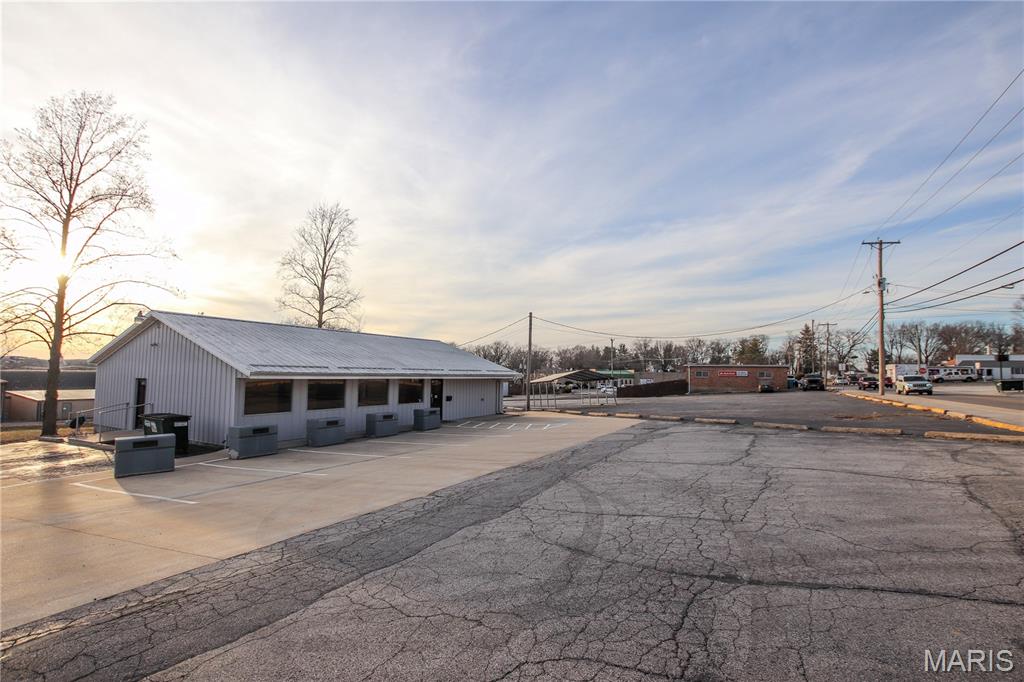 High-Traffic Commercial Opportunity  2,016 Sq. Ft. on .702 Acre m/l
Well-maintained and move-in ready, this 2,016 sq. ft. freestanding commercial building offers outstanding visibility in a high-traffic location between Commercial Ave and downtown Main St. If exposure and accessibility matter to your business, this property delivers. 
Designed for flexibility, the building can easily adapt to a wide variety of ventures. Over the years it has successfully operated as a movie rental store, tanning salon, beauty salon (with many salon improvements still intact), food pantry, and resale store proving its versatility and income potential.
Inside, you’ll find three large main sections of space along with additional divided rooms ideal for offices, treatment rooms, or storage. The property also includes one bathroom facility, mechanical room, kitchen area, and multiple storage spaces to support your operational needs.
Situated on approximately .702 acre (m/l), the property features a large parking lot to accommodate 20 customers and staff with ease. Utilities include all electric service, city water, sewer, and trash.
With excellent traffic flow and strong business exposure, the possibilities are endless for retail, salon, office space, specialty shop, service business, nonprofit, and more.
What’s your ambition? This prime location may be exactly what you’ve been looking for.