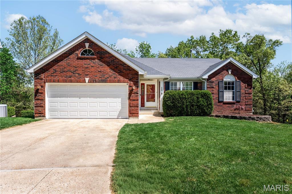 Ideally situated in the Ridges of Oakwood Farms—exclusive and sought-after enclave in Oakwood Farms Subdivision—this 3-bedroom, 2-bath atrium ranch has a finished lower level offering a seamless blend of style, comfort, and everyday functionality.  Tucked away on a quiet cul-de-sac and backing to picturesque woods, this home provides a sense of privacy and tranquility. The spaces have been designed for the way you want to live—from a convenient main floor laundry to a versatile lower-level with a den, a studio area perfect for martial arts, yoga, or creative pursuits, and your own private theater room with all the bells and whistles for memorable movie nights.  On the main floor, as you enter the heart of the home you are greeted by an inviting vaulted family room, where a full wall of atrium windows fills the space with natural light while framing tranquil, wooded views. Whether you’re enjoying the scenery or settling beside the full masonry gas fireplace on a crisp evening, this is a space that instantly feels like home.  The beautifully updated kitchen is both warm and functional, featuring 42” custom cabinetry, granite countertops, and abundant storage, including a pantry, to keep everything within easy reach. Included are Smart home SS appliances to elevate everyday living—making shopping, cooking, and cleanup not just simple, but truly enjoyable.  The vaulted primary suite is a true haven, complete with a generous walk-in closet and ample room for a comfortable sitting area. The updated ensuite bath features a separate shower and soaking tub, enhanced by surround sound for a spa-like experience, and beautifully complemented by a picture window that captures those relaxing, woodland views.  Two additional bedrooms are thoughtfully positioned and share a nicely updated hall bath, offering comfort and convenience for family or guests.  The main floor laundry is another convenient feature found in this area.  Step out to the expansive two-tier deck—easily accessed from both the dining room and the lower level—where you can savor morning coffee, enjoy relaxed outdoor dinners, or entertain guests while surrounded by peaceful, private, wooded views. The Roof is just 11 years old, and the HVAC equipment is in great shape. There is also a 2020 Water Heater and a 2023 Culligan Water Softener.  There are built-in storage shelves in the utility area and in the oversized 2 car garage (with a gorgeous, new lifetime warranty polyurea pebble floor).  This home is equipped with a load of security features as well.  Located within the neighborhood is the trailhead to the Roger Klamberg Woods Conservation Area, connecting you to miles of protected woodland trails and Bluebird Park’s amenities.  Other much loved Ballwin features include the North Pointe outdoor pool and recreation area, the community center and Ballwin golf club—all within the top-rated Rockwood School District.