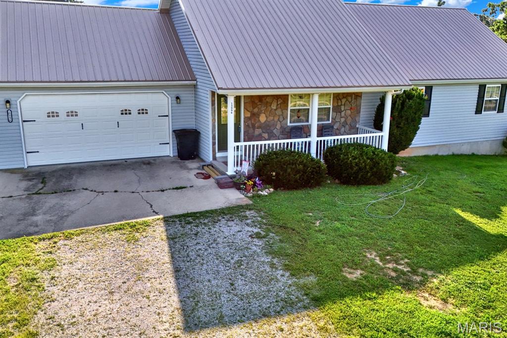 Would you like to experience living in a neighborhood surrounded by the splendor of the Mark Twain National Forest? 
Check out this move-in ready beautifully maintained ranch-style home in Plato. Built in 2007, this single-family residence perfectly balances colonial curb appeal with exceptional outdoor living. A welcoming front porch invites you into a spacious, well-designed layout featuring 4 bedrooms, 2 full bathrooms & a finished basement. The primary bedroom offers an attached bathroom with 2 walk in closets. The fourth bedroom located in the basement, includes another walk in closet for ample storage. Other highlights include an attached garage with direct interior access. HVAC has a transferable NINE YEAR Warranty! The thermostat has optional smart capabilities. Once you step outside on to the back deck you’ll find a 6ft multi gated fenced backyard. To the north of the property is an additional fenced garden area including a green house for all your seedlings & garden supplies. The gated garden is currently growing a variety of sunflowers, perennials, sage & wildflowers. There is still plenty of room for raised bed gardens & much more. Schedule your private viewing today!