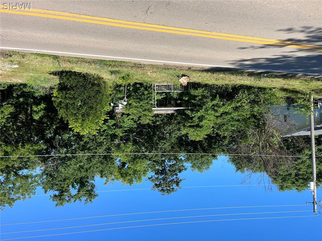 Here is a building lot located in the R-7 school district just minutes from the schools and right on State Road TT with utilities available and not in a subdivision. Currently there is an old uninhabitable mobile home located on the property that will be the buyer's responsibility to remove.  Replace the mobile home or build your home on the lot. Come take a look! Property is being sold "AS-IS".