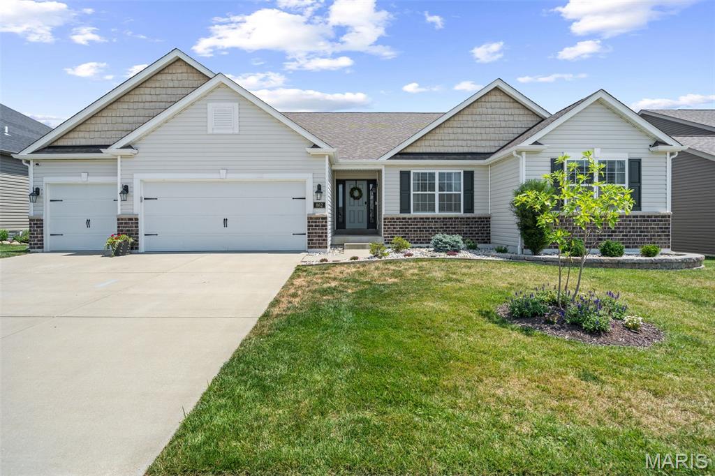 Welcome to this beautiful ranch home nestled in a picture-perfect Lake St. Louis neighborhood! A gracious entry welcomes you into an exceptional open floor plan filled with natural light. The inviting living room features a cozy gas fireplace and flows seamlessly into the dining area, perfectly positioned between the living space and the well-appointed kitchen.

The kitchen is a standout with beautiful, tall cabinets, stainless steel appliances, an expansive center island, and a walk-in pantry. Just off the three-car garage, you’ll find a convenient laundry and mudroom that makes everyday living a breeze.

The spacious primary suite offers a generous ensuite bath and a large walk-in closet. Three additional bedrooms, a full hall bath, and a powder room complete the main level.

The recently finished lower level adds even more living space with two versatile rooms and a full bath, while still offering plenty of opportunity for future expansion.

The amenities in this incredible subdivision are second to none, featuring a resort-style pool with a lazy river, multiple playgrounds, basketball and volleyball courts, scenic walking trails, and picturesque ponds with fountains and fishing. From the thoughtfully designed home to the outstanding neighborhood amenities, this property truly has it all!