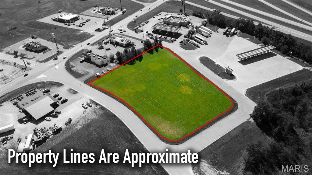 Prime commercial lot offering unlimited potential for your business! Perfectly situated near thriving businesses and popular fast food restaurants, this vacant lot is a rare opportunity to build your vision in a bustling area. With road frontage on 3 sides and a newly opened street, the lot provides visibility and easy access for both customers and deliveries. Conveniently located close to the interstate, the property offers quick and efficient routes in & out, makes it an ideal spot for a wide range of businesses. Whether you're looking to develop retail, office space, or a service-oriented business, this lots strategic location and accessibility provide endless possibilities for success. Location: City, Corner Location