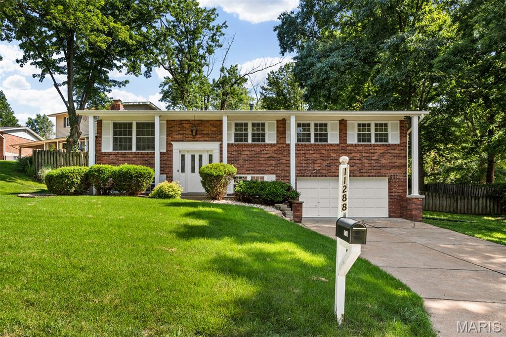 OPEN HOUSE this Sunday, 6/14, 1-3PM! Tucked into the highly sought-after Lindbergh School District, this beautifully maintained split-foyer home offers a wonderful balance of comfort, style, and functionality. With generous living spaces, a versatile floor plan, and a backyard designed for both relaxation and entertaining, this is a home that adapts effortlessly to the way you live. The main level welcomes you with an abundance of natural light and a warm, inviting atmosphere. The primary suite serves as a private retreat, complete with a walk-in closet and direct access to the patio—an ideal spot to enjoy a quiet morning coffee or unwind at the end of the day. Two additional bedrooms and a full bath provide flexibility for family, guests, or work-from-home needs. At the heart of the home, the kitchen opens to the dining area, creating an easy flow for everyday living and entertaining alike. Large windows frame views of the backyard, while the adjacent living room offers a bright and comfortable setting for gathering with family and friends. The lower level expands the home’s living space with a welcoming recreation room anchored by a cozy fireplace, creating the perfect setting for movie nights, game days, or casual gatherings. An additional bedroom on this level offers exceptional flexibility and can easily serve as a guest room, private home office, den, fitness space, hobby room, or playroom—allowing the home to adapt to your changing needs over time. Outside, the backyard offers the kind of space that is increasingly difficult to find. The patio and surrounding yard create an inviting setting for outdoor dining, weekend gatherings, gardening, or simply enjoying a peaceful afternoon outdoors. It is a space that feels both private and connected to nature. An attached two-car garage adds convenience, while the location places you moments from Whitecliff Park, Grant’s Farm, shopping, dining, and everyday amenities. Enjoy easy access to local favorites such as Fitz’s SoCo, The Barn, and The Concord Grill. Offering a desirable combination of indoor comfort, outdoor enjoyment, and an exceptional South County location, this home presents a wonderful opportunity to enjoy the very best of Lindbergh living. A thoughtful layout, flexible living spaces, and a beautiful outdoor setting make this a place you’ll be proud to call home.