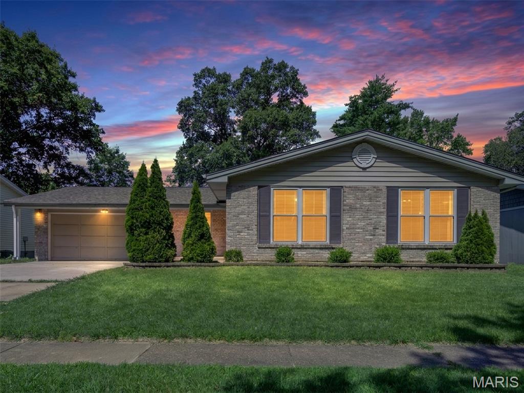 Welcome home to this beautifully updated ranch in the highly sought-after Westglen Woods subdivision! Offering 3 bedrooms, 2 full baths, and a partially finished lower level, this move-in ready home combines stylish updates with comfortable everyday living. Luxury vinyl plank flooring and fresh neutral paint create a bright, modern feel throughout the main living areas, while the inviting family room features a cozy wood-burning fireplace and sliding glass doors leading to a spacious 10' x 15' covered patio—perfect for relaxing or entertaining year-round.

Just off the entry, a sun-filled den offers the perfect space for a home office, playroom or second living area, while the adjoining formal dining room is ideal for hosting holiday dinners and family celebrations. The beautifully updated kitchen features rich cabinetry, updated countertops, a designer tile backsplash, deep sink, modern faucet, and abundant workspace. Retreat to the spacious primary suite featuring a beautifully renovated bath with a custom Onyx tub/shower surround, new vanity, toilet, lighting and fixtures. Two additional generously sized bedrooms and a full hall bath complete the main level.

Need extra space? The partially finished lower level offers endless flexibility with a huge recreation room, gaming/computer nook, potential sleeping area, a large utility/storage room, plus a well-equipped laundry room complete with a utility sink, and storage cabinets with folding counter. Recent lower level improvements include drywall, fresh paint, baseboards, recessed lighting, and painted exposed ceiling joists for a clean, contemporary finish.

Outside, you'll appreciate the home's exceptional curb appeal, highlighted by a charming stone courtyard near the front entry—the perfect place to enjoy your morning coffee. Out back, the 10' x 15' covered patio overlooks a large, level fenced yard with plenty of room for pets, play, gardening, or entertaining. Additional updates include a new driveway and an epoxy-coated garage floor.

Located in the award-winning Rockwood School District and just minutes from parks, shopping, restaurants, and major commuter routes, this beautifully updated Ballwin ranch offers the perfect blend of comfort, style, and convenience. Don't miss your opportunity to make it yours!
