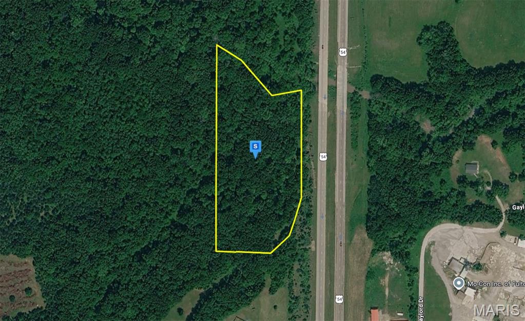 Discover this 7-acre residential lot in the Fulton area of Callaway County. Featuring rolling, wooded terrain, the property offers a peaceful natural setting with privacy and character while being conveniently located near US-54. City water and sewer are available, providing added convenience for future development. Located in a desirable area, the property offers easy access to nearby shopping, dining, schools, and major roadways while maintaining a quiet atmosphere. This lot presents an excellent opportunity to build a future home in Central Missouri. Street addresses can be for listing purposes only and vacant land will receive a true street address once improved.