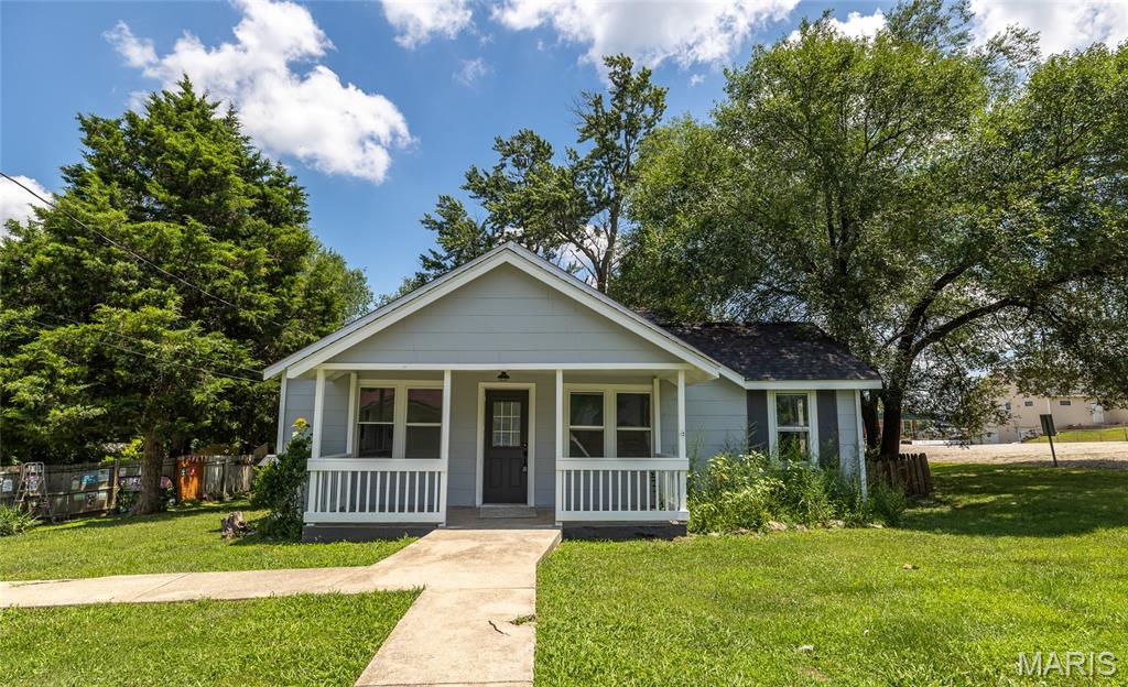 Welcome to this beautifully remodeled 5-bedroom, 2-bath home in the heart of Salem, Missouri, where timeless charm meets modern comfort. From the moment you step onto the inviting covered front porch, you'll feel right at home. Whether you're enjoying your morning coffee or relaxing after a long day, this welcoming space sets the tone for everything this property has to offer. Inside, you'll find fresh updates throughout, including brand-new carpet and durable laminate flooring that create a bright, move-in-ready atmosphere. The spacious layout offers the flexibility today's buyers are looking for, with five generously sized bedrooms that can easily accommodate a growing family, overnight guests, or even a dedicated home office. At the heart of the home, the updated kitchen features a large center island, making meal prep, casual dining, and entertaining effortless while keeping everyone connected. A partial unfinished basement provides valuable storage space and room for future expansion, while the detached garage offers additional parking, workshop potential, or space for hobbies and outdoor equipment. Conveniently located near Salem's schools, shopping, dining, and everyday amenities, this home delivers the perfect blend of comfort, functionality, and small-town charm. Whether you're searching for your forever home or simply need more room to spread out, this beautifully updated property is ready for its next chapter. Don't miss your opportunity to make this Salem gem your own—schedule your private showing today and see everything this exceptional home has to offer!