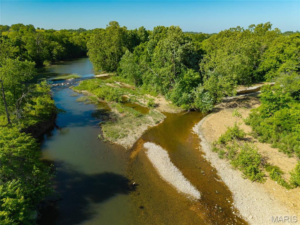 This 270 acre parcel has 1/2 mile of Gasconade river running through it. Providing great fishing and river access there is Indian Creek another year round stream flowing through the property into the Gasconade River. This large 270 acre tract is a hard find it offers awesome Hunting and fishing with the flexibility of raising cattle or livestock of your choice and raising hay as there is 120 acres of fertile bottom soil currently producing close to 600 large round bales per year. This bottom land can be turned into corn, Alfalfa or any hay crop of your choosing it has been producing without the use of fertilizer or spray. The top half of the Farm is accessed across the Gasconade River where the owners have installed a concrete slab for easy crossing. The top part of the farm has a fenced spring fed pond with a concrete waterer. There is a newly drilled well set up completely on solar power that provides water to 3 more concrete waterers. There is a new septic system and Solar to provide power for that off grid cabin of your dreams. There is another well and power along 38 Hwy on the south side of this parcel across the Gasconade River allowing for easy building and well and power on each side of the river. This is truly a special piece of property with the kind of water availability that people are searching for. Don't let this opportunity to own this great piece of the Ozarks pass you by.