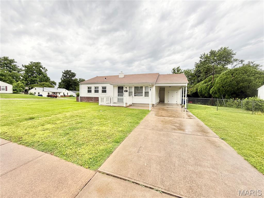 Welcome home to this beautifully updated 3-bedroom, 1-bath ranch-style home offering the ease and convenience of single-level living! Filled with natural light, the inviting living room features a large picture window that creates a bright and airy feel. The eat-in kitchen has been updated with newer cabinetry and stainless steel appliances, providing both style and functionality. Main-floor laundry adds everyday convenience, while the fully updated hall bath offers modern finishes and comfort. One of the bedrooms connects to a versatile bonus room—perfect for a home office, nursery, sitting room, or additional flex space to fit your needs. Outside, enjoy a fenced backyard ideal for relaxing, pets, or entertaining, along with a carport and attached storage shed for added practicality. With updates throughout and move-in-ready appeal, this home is a must-see!