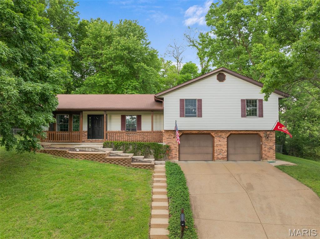 Nestled on a quiet cul-de-sac on the desirable east side of Washington, this inviting 4-bedroom, 2.5-bath multi-level home offers the perfect blend of comfort, space, and privacy. Backing to mature trees, the property provides a peaceful setting with a fenced backyard designed for relaxation and outdoor enjoyment. Entertain with ease on the screened-in deck or open deck, ideal for dining, gatherings, or simply enjoying the natural surroundings. Inside, you’ll find an open floor plan highlighted by vaulted ceilings and abundant natural light. Multiple living areas, including a spacious family room, provide flexibility for everyday living and entertaining. With 4 bedrooms, 2.5 bathrooms, and a convenient 2-car over-sized garage, this home offers plenty of room to grow in a sought-after location close to schools, parks, shopping, and everyday conveniences. A wonderful opportunity to enjoy privacy, space, and a great neighborhood setting!