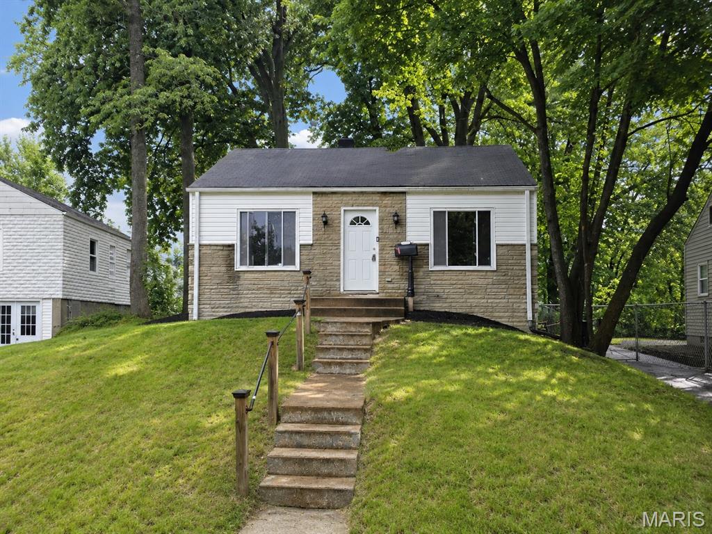 Discover the potential of this recently renovated 3-bedroom, 2-bath home in the heart of St. Ann! Featuring an inviting open-concept layout, the spacious kitchen is designed for both everyday living and entertaining, complete with a cooktop, double wall ovens, and a large peninsula offering plenty of prep space and seating.

The main level includes a comfortable bedroom and a full bath, providing flexibility for guests, a home office, or convenient single-level living. Upstairs, you'll find two separate bedrooms and an additional full bath, creating a functional layout with privacy for everyone.

The full unfinished walk-out basement offers abundant storage and endless possibilities for future finishing or additional living space. Major mechanical updates include a newer furnace (2020) and a newer water heater, helping provide peace of mind for years to come.

Outside, enjoy a large backyard with plenty of room for outdoor activities, gardening, or entertaining.

Whether you're looking for a place to call home or seeking a strong addition to your investment portfolio, this property presents an excellent opportunity as a rental or long-term hold. Don't miss your chance to own a move-in-ready home with updates, space, and income potential!