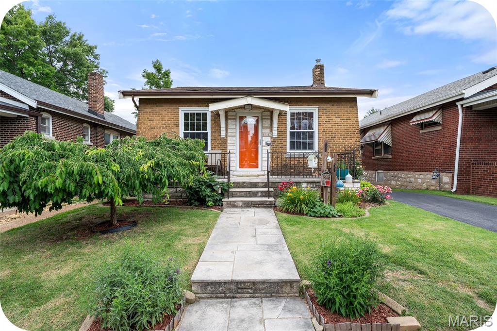 Open House Sunday, June 14 1-3pm. You are going to LOVE this home! It is just too darned cute in every possible way! Located in the popular Tower Grove South neighborhood close to parks, restaurants, shopping and more this house is a slam dunk! As soon as you pull up you will notice how much love and care has gone into maintaining this sweet south city bungalow.  Open the front door and walk into a spacious, bright and cheerful living room with hardwood floors, stained glass windows and decorative fireplace. The living room leads into a large formal dining room perfect for hosting friends and family. The updated kitchen is BEAUTIFUL! So thoughtfully laid out with tons of storage, stainless appliances, and granite countertops. Two good-sized bedrooms and an updated bathroom are the icing on the cake! Off the kitchen you will find the most delightful, enclosed porch overlooking a back yard city oasis with beautiful flowers, bushes and a 1 car garage. The unfinished basement is clean and dry and has a ton of potential. Finish it off or just use it as it currently is for storage and laundry. All systems are in good working order, and the roof is less than 1 year old! This cozy bungalow feels like 'home' and won't last long. Make your appointment today!