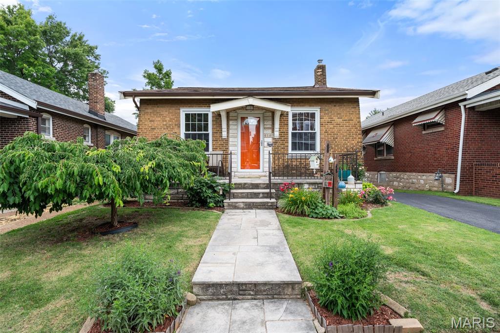 Open House Sunday, June 14 1-3pm. You are going to LOVE this home! It is just too darned cute in every possible way! Located in the popular Tower Grove South neighborhood close to parks, restaurants, shopping and more this house is a slam dunk! As soon as you pull up you will notice how much love and care has gone into maintaining this sweet south city bungalow.  Open the front door and walk into a spacious, bright and cheerful living room with hardwood floors, stained glass windows and decorative fireplace. The living room leads into a large formal dining room perfect for hosting friends and family. The updated kitchen is BEAUTIFUL! So thoughtfully laid out with tons of storage, stainless appliances, and granite countertops. Two good-sized bedrooms and an updated bathroom are the icing on the cake! Off the kitchen you will find the most delightful, enclosed porch overlooking a back yard city oasis with beautiful flowers, bushes and a 1 car garage. The unfinished basement is clean and dry and has a ton of potential. Finish it off or just use it as it currently is for storage and laundry. All systems are in good working order, and the roof is less than 1 year old! This cozy bungalow feels like 'home' and won't last long. Make your appointment today!