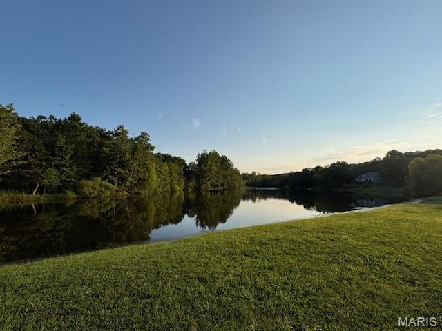Lake Front Lot on Small Private Lake / Summer Lake! This a private oasis on this 12 acre lake. Imagine walking out your back door and casting out your line ... 

Live like you're on vacation every day with resort-style amenities, also including:

4 private community lakes for fishing, boating, kayaking

Beaches, swimming, and scenic lake views

Golf course, country club, and on-site restaurant

Hiking, biking trails, campgrounds, and sand volleyball

A golf cart-friendly community for relaxed neighborhood living

You can bring your own builder and plans, or hold the land as an affordable way to enjoy Raintree's full range of recreation and lifestyle benefits.

Ownership includes access to the Country Club for just $271/year, and full community amenities for only $250/year. All of this just 35 minutes from South County (63128)!

Build your own lifestyle and just getaway from it all.  See all photos for a glimpse into the incredible Raintree lifestyle. As a resident myself, I can confidently say: it’s an amazing place to live, play, and relax. Come join us!