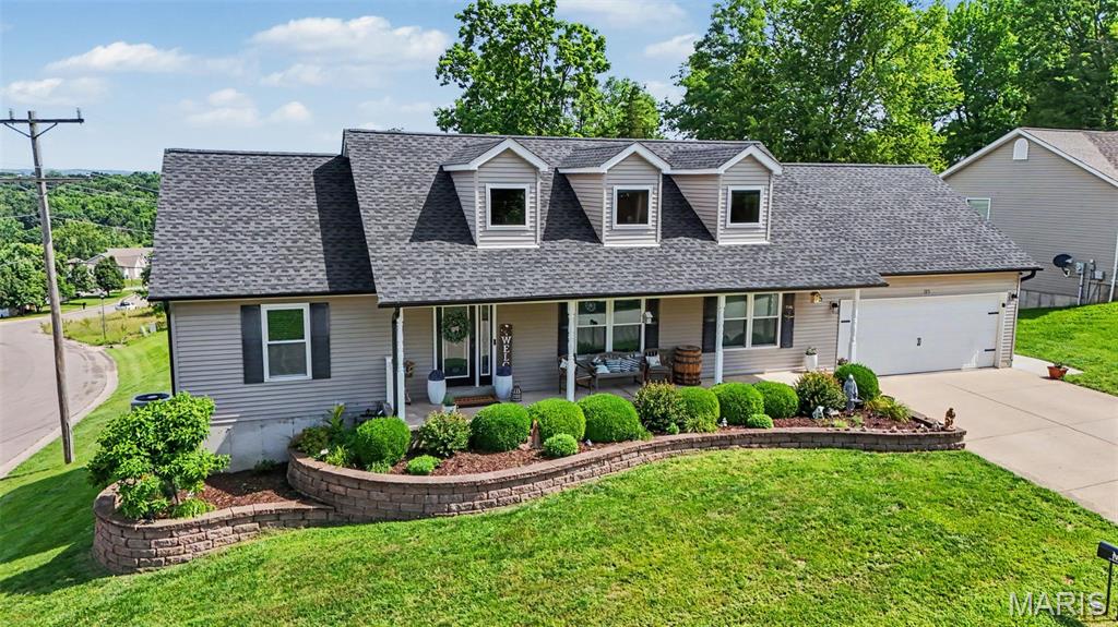 Prepare to fall in love with this 4-bedroom, 3-bathroom ranch home in New Haven! From the moment you arrive, the serene, covered front porch welcomes you by offering a shaded spot to sip your morning coffee and watch the world wake up. Step inside to discover a bright & airy open living room with vaulted ceilings. The  eat-in kitchen is the true heart of this home with a breakfast bar, stainless appliances, rich wood cabinetry, custom tile backsplash, new countertops, & spacious pantry. The dining area is large enough for a sideboard alongside a large table for entertaining. Sliding glass doors lead out to the deck with views that are breathtaking no matter the time of day. 

The thoughtful split-bedroom layout ensures the spacious main floor primary suite remains a quiet sanctuary. Here, you'll enjoy the large walk-in closet and private ensuite bath. Two additional bedrooms and a full bath are situated on the opposite end of the main floor.

The walk-out lower level expands your living space significantly, boasting a fourth bedroom (currently used as an office), a full bath, and a large L-shaped rec room. An unfinished storage room has built-in shelving to give all of your belongings a proper home.

The true showstopper of this home is the backyard paradise. Step out onto the upper deck to take in stunning, elevated local views before heading down to the beautifully landscaped, fenced backyard. Here, summer days are spent lounging by the above-ground saltwater pool, framed by a beautiful pergola and lush landscaping that feels entirely serene. Enjoy watching the colorful sunsets while relaxing under the decorative lights hung carefully around this outdoor oasis.

Positioned on a corner lot uptown, this home is complete with a fully finished attached 2-car garage and a main floor laundry with additional storage. Schedule your tour TODAY and claim your piece of paradise!