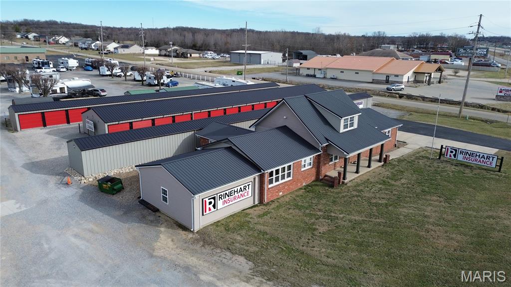 Position your business for success with this highly visible office property along N Outer Road in Dexter, just off U.S. Route 60 (future Interstate 57). With the current office tenant vacating in August, this property offers a rare opportunity for an owner-occupier to step into a well-maintained, functional office layout while benefiting from additional on-site income.

The ±3,000 SF office space is ideally suited for professional services, featuring four private offices, a large conference room, spacious reception area, kitchen/breakroom, and ample storage. Previously home to a long-standing insurance office, the layout supports a wide range of users including legal, financial, medical, or administrative operations.

In addition to the office space, the property includes storage units that provide consistent supplemental income, helping offset occupancy costs and enhancing overall investment appeal.

With strong visibility from a major highway corridor and easy access, this is a strategic opportunity to own your space while building equity and generating income.