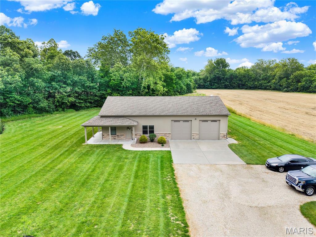 Welcome to peaceful country living with this beautifully maintained 2 bedroom, 2 bathroom shop house situated on 10 scenic acres. Built in 2018, this move in ready home offers the perfect combination of modern comfort and outdoor lifestyle.

Inside, you’ll find a spacious layout featuring a large master suite with a walk in closet, while outside offers endless opportunities to relax and enjoy nature. The oversized 30x40 garage provides ample space for vehicles, storage, hobbies, or workshop needs, and even includes a storm shelter for added peace of mind.

Enjoy evenings on the covered front porch overlooking the manicured property, complete with a fenced backyard, wet weather creek, and excellent deer hunting right out your back door. Located in a quiet neighborhood with beautiful surroundings, this property is ideal for anyone looking for privacy, recreation, and country charm all in one package.